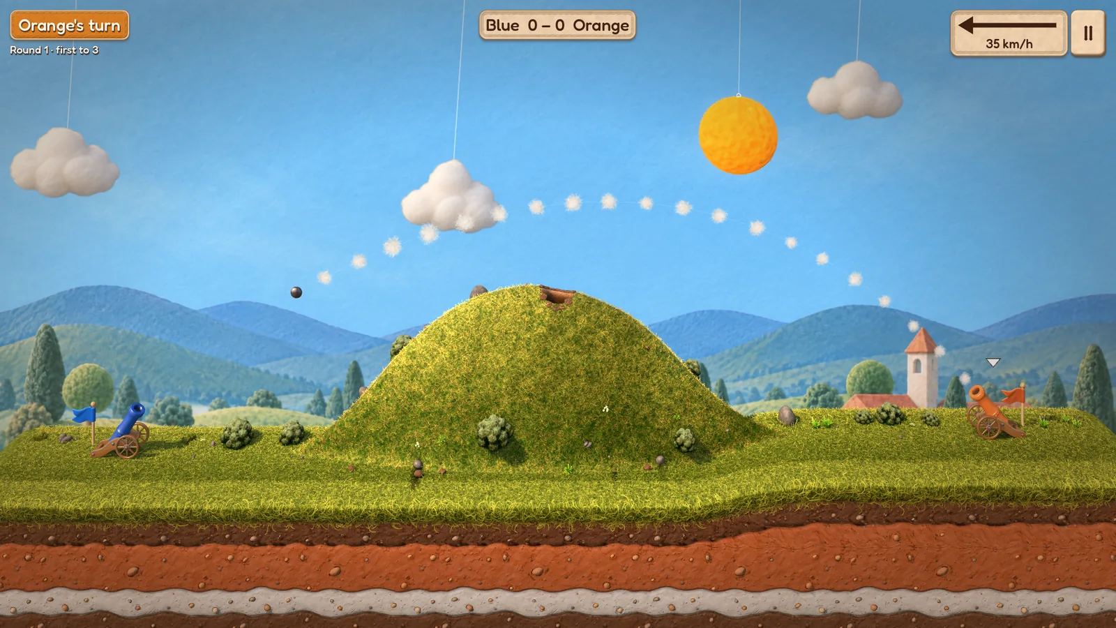 The orange cannon's shell arcs over a grassy hill toward the blue cannon, a trail of cotton puffs behind it.