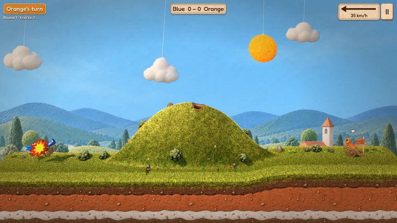 A felt star bursts on the blue cannon as the orange shell hits it.